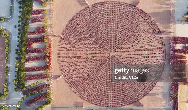 Aerial view of students of a martial art school performing Shaolin Kung Fu at the foot of Mount Song on June 5, 2018 in Zhengzhou, Henan Province of...