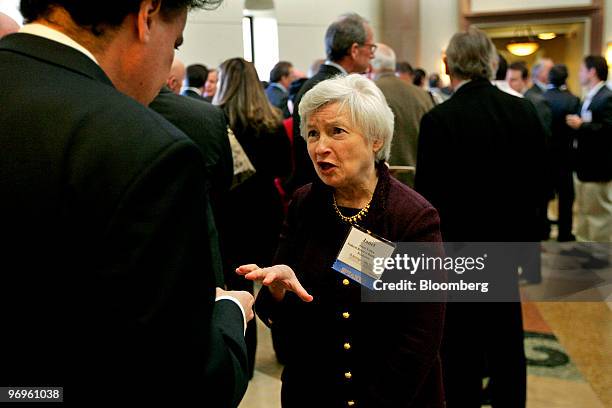 Janet Yellen, president of the Federal Reserve Bank of San Francisco, center, chats with an attendee before giving a speech at the University of San...