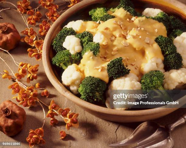 cauliflower and broccoli with cheese sauce - cheese sauce stock pictures, royalty-free photos & images