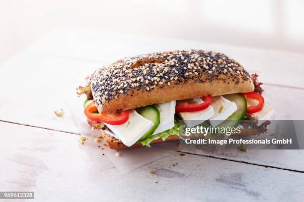 sesame and poppy seed roll with camembert, vegetables and lettuce - curly endive stock pictures, royalty-free photos & images