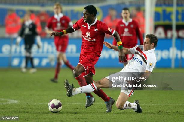 Matthias Lehmann of St. Pauli tackles Georges Mandjeck of Kaiserslautern during the Second Bundesliga match between 1.FC Kaiserslautern and FC St....