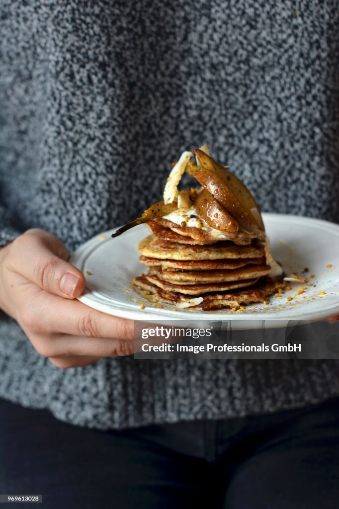 Pancakes with poached pears, maple syrup and bee pollen