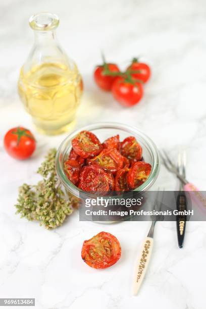 confit tomatoes in a glass jar - confit stock pictures, royalty-free photos & images