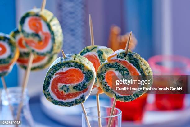 omelette rolls with wasabi and smoked salmon (party food) - sea trout stock pictures, royalty-free photos & images