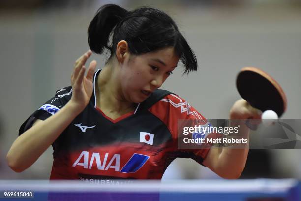 Miyu Nagasaki of Japan competes against Xingtong Chen of China during the women's singles round one match on day one of the ITTF World Tour LION...