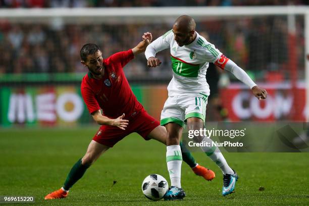 Portugal's midfielder Bernardo Silva vies for the ball with Algelia's midfielder Yacine Brahimi during the FIFA World Cup Russia 2018 preparation...