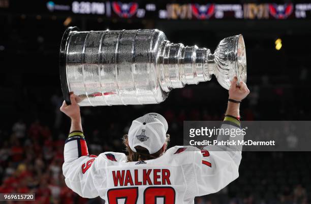 Nathan Walker of the Washington Capitals celebrates with the Stanley Cup after their team defeated the Vegas Golden Knights 4-3 in Game Five of the...