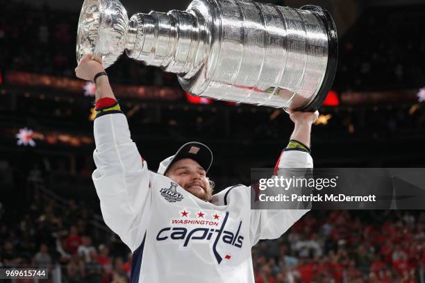 Nathan Walker of the Washington Capitals celebrates with the Stanley Cup after their team defeated the Vegas Golden Knights 4-3 in Game Five of the...