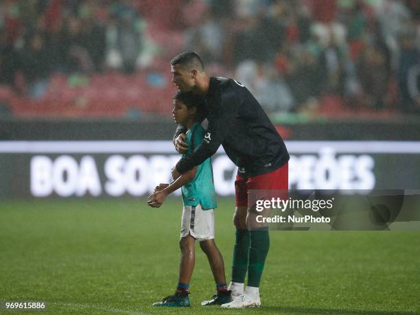 Portugal's forward Cristiano Ronaldo's son Cristianinho plays with is father at the end of during the FIFA World Cup Russia 2018 preparation match...