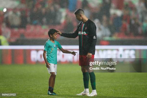 Portugal's forward Cristiano Ronaldo's son Cristianinho plays with is father at the end of during the FIFA World Cup Russia 2018 preparation match...