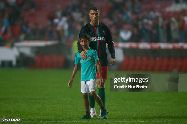 Portugal forward Cristiano Ronaldo son Cristianinho plays with is father at the end of the International Friendly match between Portugal and Algeria...