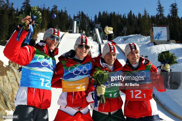 Gregor Schlierenzauer, Thomas Morgenstern, Andreas Kofler, Wolfgang Loitzl of Austria celebrate their gold medal in the men's ski jumping team event...