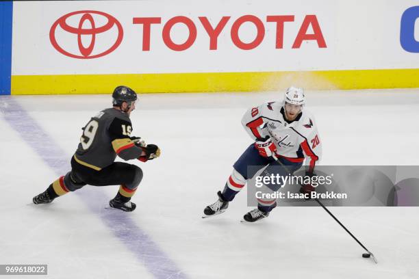 Lars Eller of the Washington Capitals is defended by Reilly Smith of the Vegas Golden Knights during the first period in Game Five of the 2018 NHL...