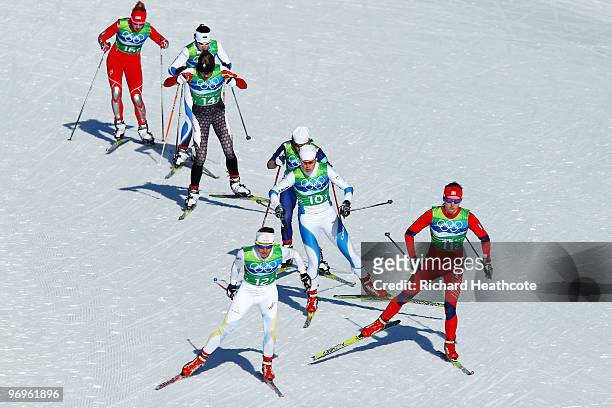 Anna Haag of Sweden and Celine Brun-Lie of Norway lead the pack during the cross country skiing ladies team sprint semifinal 2 on day 11 of the 2010...