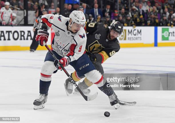 Dmitry Orlov of the Washington Capitals is defended by Tomas Tatar of the Vegas Golden Knights during the third period in Game Five of the 2018 NHL...