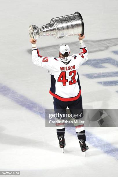 Tom Wilson of the Washington Capitals hoists the Stanley Cup after his team defeated the Vegas Golden Knights 4-3 in Game Five of the 2018 NHL...