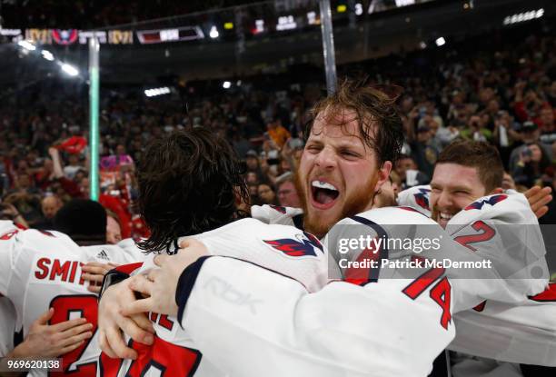 Oshie, John Carlson of the Washington Capitals celebrate with their teammates after Game Five of the 2018 NHL Stanley Cup Final between the...