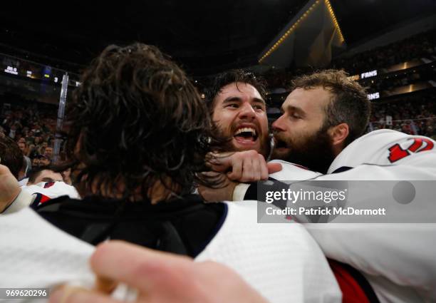 Brett Connolly, right, and Tom Wilson of the Washington Capitals celebrate with their teammates after Game Five of the 2018 NHL Stanley Cup Final...