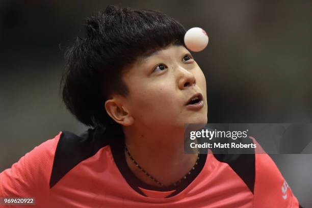 Mi Zi of China competes against Tianwei Feng of Singapore during the women's singles round one match on day one of the ITTF World Tour LION Japan...