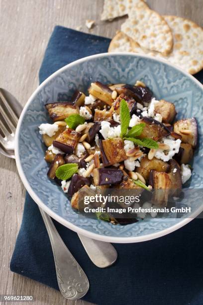 aubergine and feta cheese salad with pine nuts - bohnenkraut stock-fotos und bilder