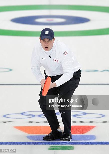 Skip John Shuster of the USA follows the stone during the men's curling round robin game between Canada and the USA on day 11 of the Vancouver 2010...