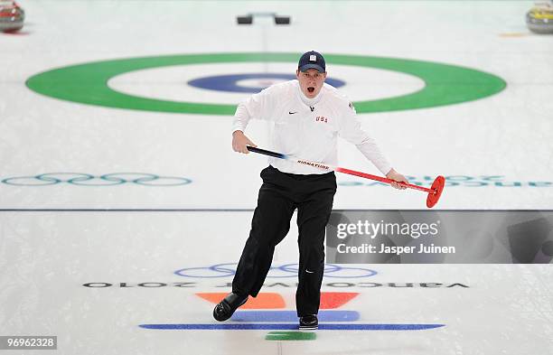 Skip John Shuster of the USA reacts as he follows the stone during the men's curling round robin game between Canada and the USA on day 11 of the...