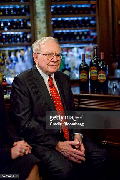Warren Buffett, chief executive officer of Berkshire Hathaway, pauses during a television interview in advance of a charity lunch with a group led by...