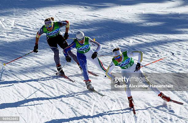 Claudia Nystad of Germany, Arianna Follis of Italy and Anna Haag of Sweden compete during the cross country skiing ladies team sprint final on day 11...