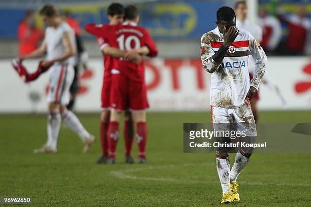 Charles Takyi of St. Pauli looks dejected after losing 0-3 the Second Bundesliga match between 1.FC Kaiserslautern and FC St. Pauli at Fritz-Walter...