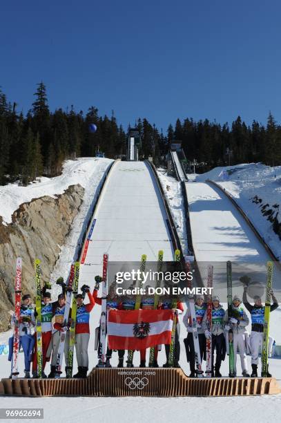 Germany's silver medalists Michael Neumayer, Andreas Wank, Martin Schmitt and Michael Uhrmann, Austria's gold medalists Wolfgang Loitzl, Andreas...