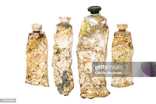 old used paint tubes on white - paint tube stock pictures, royalty-free photos & images