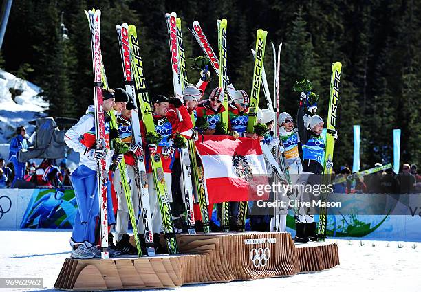 Team Germany , team Austria and team Norway stand on the podium after the men's ski jumping team event on day 11 of the 2010 Vancouver Winter...