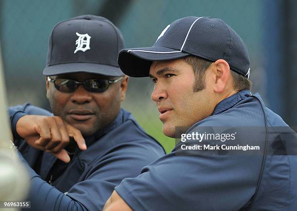 Johnny Damon of the Detroit Tigers talks with hitting coach Lloyd McClendon during Damon's first workout with the Tigers on February 22, 2010 in...