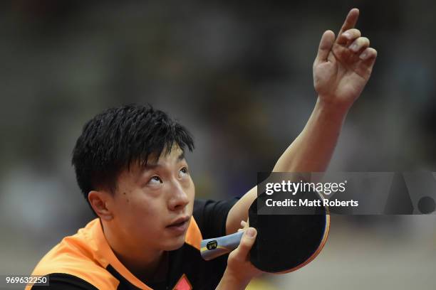 Long Ma of China competes against Hung-Chieh Chiang of Chinese Taipei during the men's singles round one match on day one of the ITTF World Tour LION...