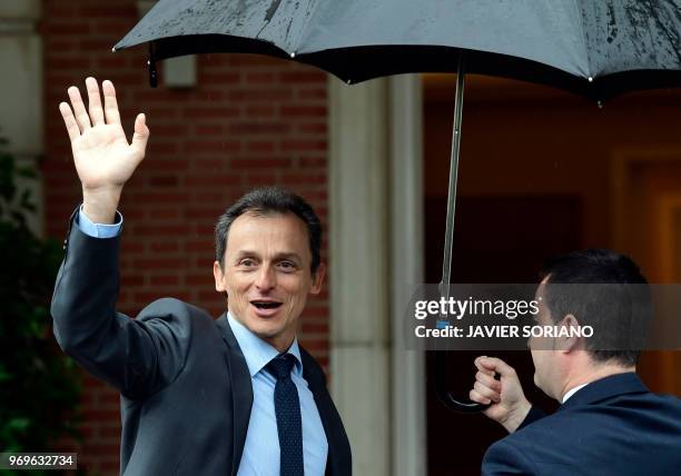 Spanish minister of science, innovation and universities Pedro Duque waves as he arrives prior to holding the new government's first cabinet meeting...