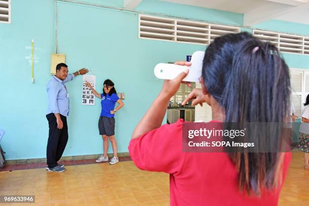 French ophthalmologist is testing eyes of the school girls. Numerous French medical NGO's are offering their help to the Happy Chandara School every...