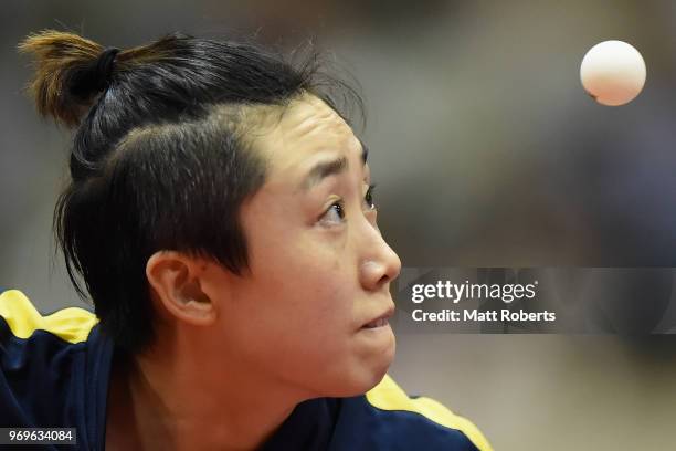 Tianwei Feng of Singapore competes against Mi Zi of China during the women's singles round one match on day one of the ITTF World Tour LION Japan...