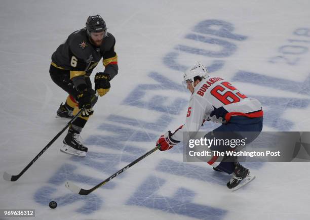 Washington left wing Andre Burakovsky tries to get the puck past Vegas defenseman Colin Miller during the first period of the game between the...