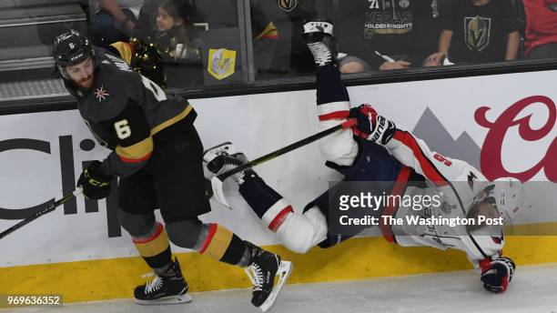 Vegas Golden Knights defenseman Colin Miller upends Washington Capitals defenseman Michal Kempny in the first period during game five of The Stanley...
