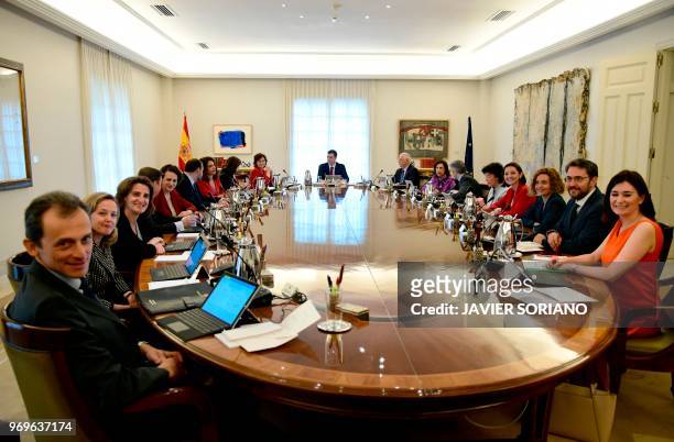 Spanish Prime Minister Pedro Sanchez chairs his first cabinet meeting at La Moncloa palace in Madrid on June 8, 2018. - King Felipe VI yesterday...