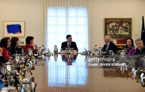 Spanish Prime Minister Pedro Sanchez chairs his first cabinet meeting at La Moncloa palace in Madrid on June 8, 2018. King Felipe VI yesterday swore...