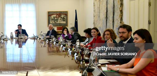 Spanish Prime Minister Pedro Sanchez chairs his first cabinet meeting at La Moncloa palace in Madrid on June 8, 2018. - King Felipe VI yesterday...