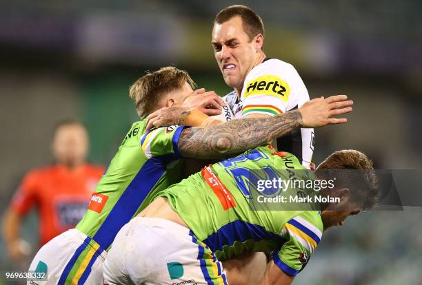 Isaah Yeo of the Panthers is tackled during the round 14 NRL match between the Canberra Raiders and the Penrith Panthers at GIO Stadium on June 8,...