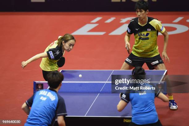 Kasumi Ishikawa and Maharu Yoshimura of Japan compete against Woojin Jang and Jihee Jeon of South Korea during the mixed doubles quarter-final on day...