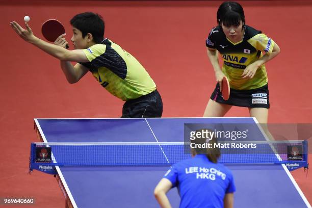 Miu Hirano and Tomokazu Harimoto of Japan compete against Ching Ho Lee and Kwan Ho of Hong Kong during the mixed doubles quarter-final match on day...