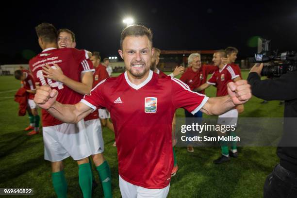 Alex Svedjuk and team mates celebrate following a 4 - 2 victory for Karpatalya against Szekely Land during the Conifa Paddy Power World Football Cup...