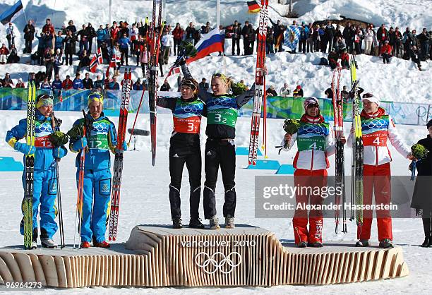 Charlotte Kalla and Anna Haag of Sweden celebrate silver, Evi Sachenbacher-Stehle and Claudia Nystad of Germany gold and Irina Khazova and Natalia...