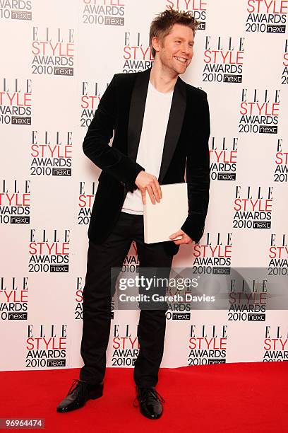 Christopher Bailey poses with his best international designer award in front of the winners boards at the Elle Style Awards 2010 held at The Grand...