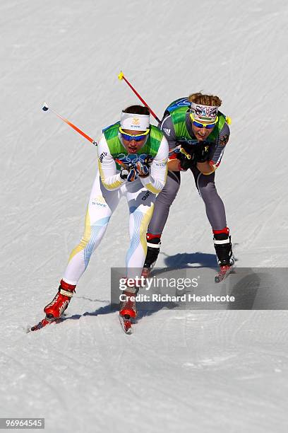 Anna Haag of Sweden and Claudia Nystad of Germany compete during the cross country skiing ladies team sprint final on day 11 of the 2010 Vancouver...