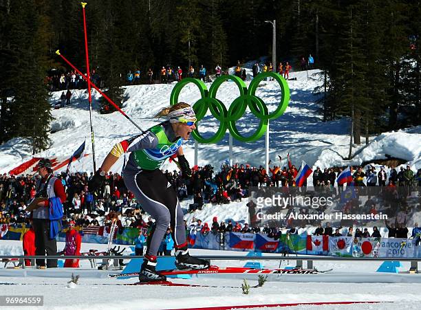 Claudia Nystad of Germany celebrates as she crosses the finish line to win the gold medal during the cross country skiing ladies team sprint final on...